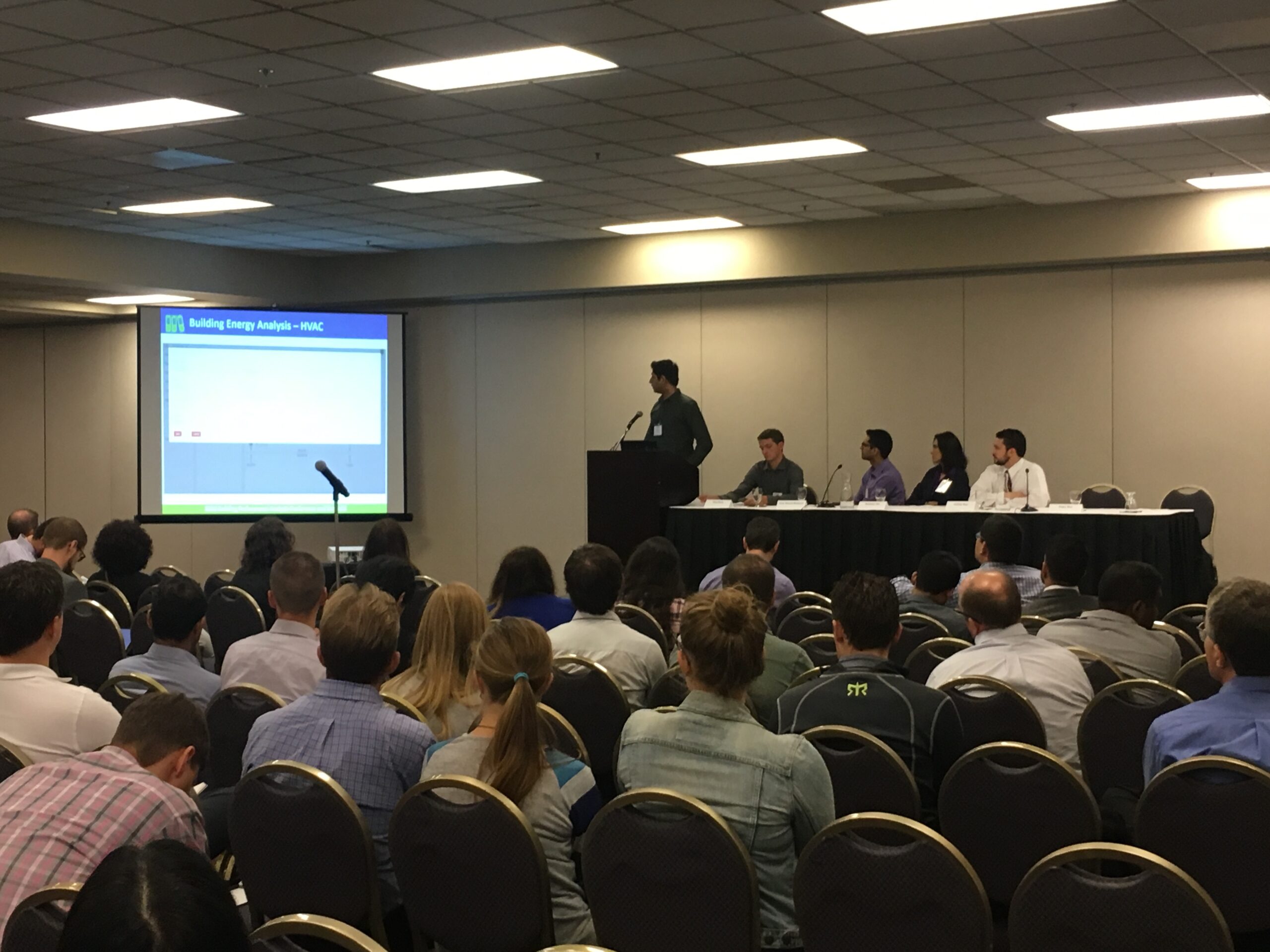 Group of people listening to an industry presentation